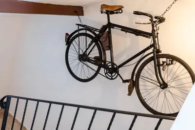 a bike is hanging on a wall at La terrasse de Tiss in Bédoin