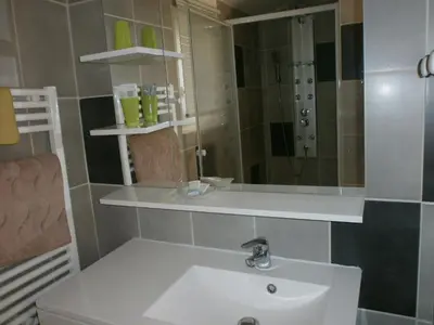 a bathroom with a sink and a mirror at Pervenches in Jonquerettes
