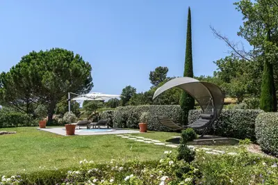 a garden with a sculpture in a park at Coquillade Provence - Relais & Châteaux in Gargas