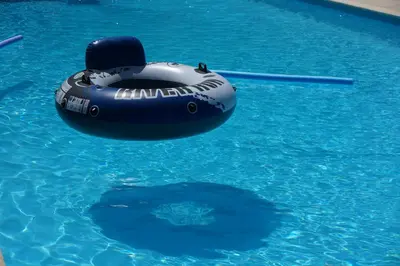 an inflatable raft in a swimming pool at le Gecko en Provence in La Roque-sur-Pernes