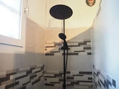 a shower in a bathroom with a tile floor at Chalet by Mont Ventoux with Stunning Views in Bédoin