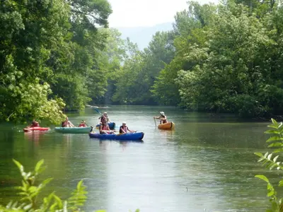 a group of people kayaking down a river at Cozy Noves Home with Pool Access in Noves