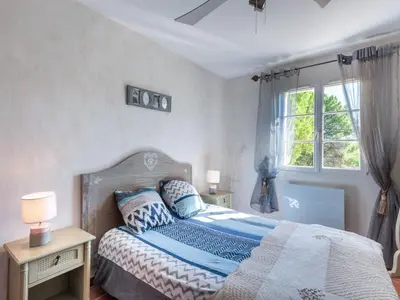 a bedroom with a bed and a window at Holiday Home Mas de L'Oulivier by Interhome in Roussillon