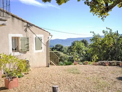 an external view of a house with a garden at Holiday Home Les Cairnes by Interhome in Viens