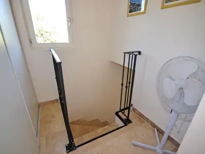 a fan in the corner of a room at Holiday Home Les Cairnes by Interhome in Viens
