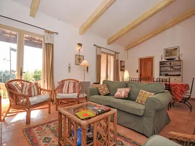 a living room with a green couch and chairs at Holiday Home Les Cairnes by Interhome in Viens