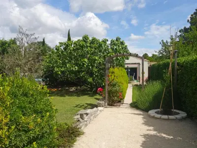 a garden with a pathway leading to a house at Apartment Haider by Interhome in Caumont-sur-Durance