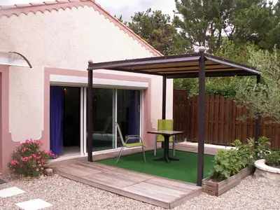 a pergola with a table on a patio at Apartment Haider by Interhome in Caumont-sur-Durance