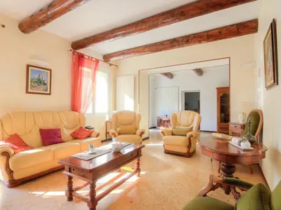 a living room with couches and chairs and a table at Holiday Home de la Roque by Interhome in Althen-des-Paluds