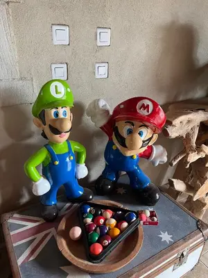 two toy mario figurines sitting on top of a table at Mas de Nonin St Rémy de Provence in Noves