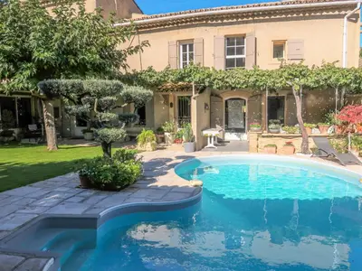 a swimming pool in the yard of a house at Holiday Home La Croix du Puits by Interhome in Robion en Luberon
