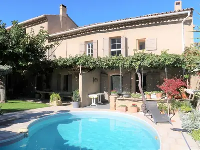 a house with a swimming pool in front of it at Holiday Home La Croix du Puits by Interhome in Robion en Luberon