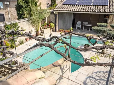 an overhead view of a swimming pool with a tree branch at Holiday Home La Croix du Puits by Interhome in Robion en Luberon