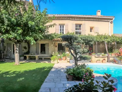 a house with a swimming pool in front of a yard at Holiday Home La Croix du Puits by Interhome in Robion en Luberon
