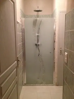 a shower with a glass door in a bathroom at Le Mas d'Hermès in Plan-dʼOrgon