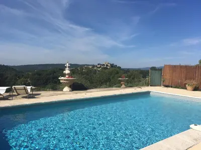 a large swimming pool in a yard with at L'Eden in Ansouis