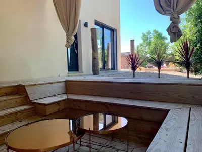 a room with two tables and a large window at Villa en campagne avec piscine et jacuzzi in Aix-en-Provence