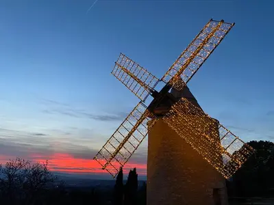 a windmill with christmas lights on top of it at la bonbonniere - Townhouse Saint-Saturnin-lès-Apt in Saint-Saturnin-les-Apt