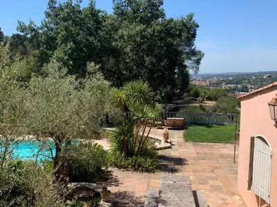a garden with a pool and trees and a house at La Farigoule - Sainte-Victoire - Vue exceptionnelle sur Aix-en-Provence in Aix-en-Provence