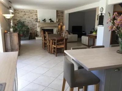 a kitchen and living room with a table and chairs at Large family home with private pool in Vignères, 10 sleeps. in Cavaillon
