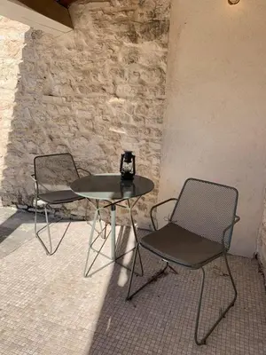 two chairs and a table and a table and chairs at Domaine de Carraire in Aix-en-Provence