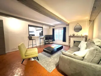a living room with a couch and a chair at Maison Alberta in Aix-en-Provence