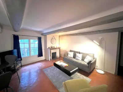 a living room with a couch and a table at Maison Alberta in Aix-en-Provence