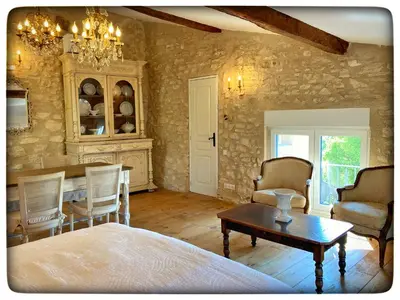 a room with a table and chairs and a dining room at La Providence in Apt