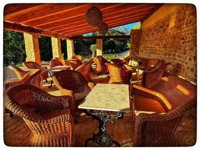 a group of chairs and tables on a patio at La Providence in Apt