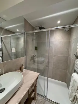 a bathroom with a shower and a sink at Le Clos de Manon in Gordes