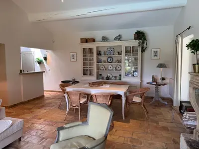a living room with a table and chairs at Le Clos de Manon in Gordes