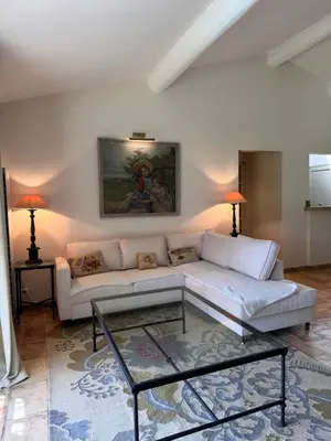a living room with a couch and a coffee table at Le Clos de Manon in Gordes