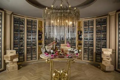 a large wine room with a chandelier and a table at Villa Gallici Hôtel & Spa in Aix-en-Provence