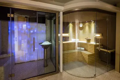 a bathroom with a glass shower with a tub at Villa Gallici Hôtel & Spa in Aix-en-Provence