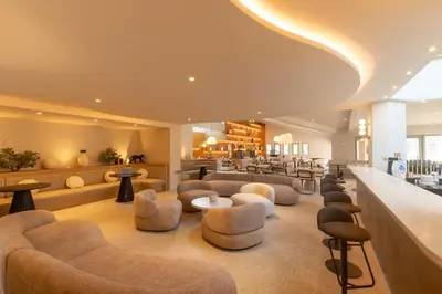 a salon with couches and chairs and a waiting room at Golden Tulip Avignon Le Paradou in Avignon