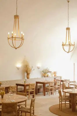 a bar with stools in a room at Le Moulin, Lourmarin, a Beaumier Hotel in Lourmarin
