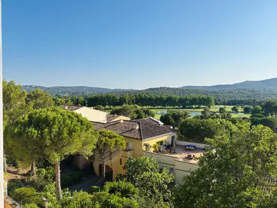 a woman and a girl sitting at a table eating breakfast at Village Pierre & Vacances Pont Royal en Provence in Mallemort