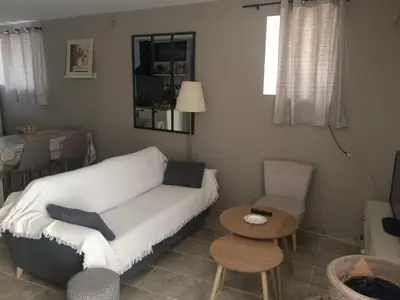 a living room with a couch and a table at Chez Adeline in Céreste