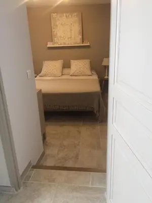 a small bedroom with a bed in a room at Chez Adeline in Céreste