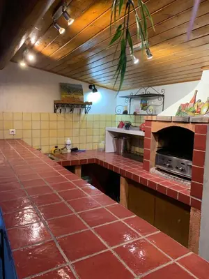 a kitchen with a brick counter and an oven at La Campanette en Luberon -Piscine privée in Cheval-Blanc