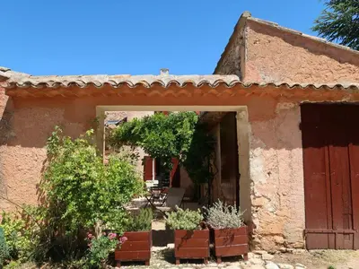 an entrance to a house with plants in a yard at Holiday Home Les Huppes by Interhome in Saint-Saturnin-les-Apt