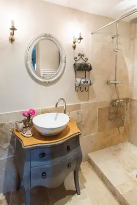 a bathroom with a sink and a shower at Le Mas Silvestre in Saint-Saturnin-les-Apt