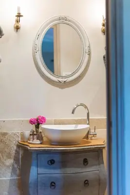a bathroom with a sink and a mirror at Le Mas Silvestre in Saint-Saturnin-les-Apt