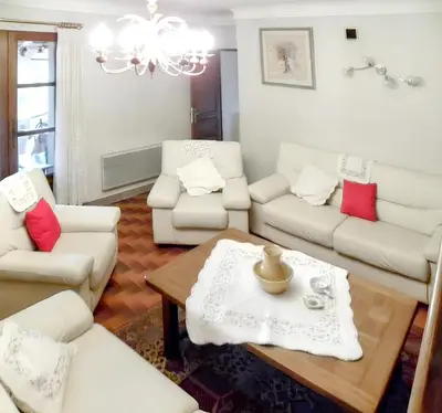 a living room with white furniture and a chandelier at Villa spacieuse à Lioux avec piscine privée et vue montagne in Lioux