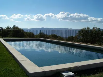 a swimming pool with a view of the water at La Bastide de Ninou maison de vacances Luberon in Viens