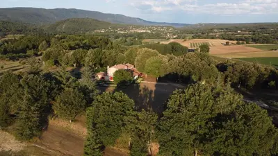 an aerial view of a house in the middle of trees at Les Néfliers chambre d'hôtes in Céreste