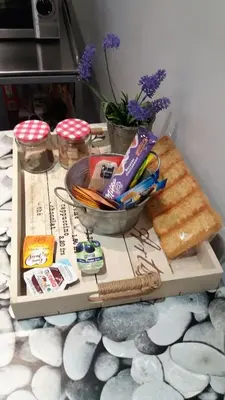 a table with a bowl of food and bread at Studio ensoleillé, typique centre historique, wifi in Aix-en-Provence