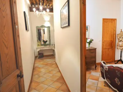 a hallway with a mirror and a dressing room at Cent Cinq - unique apartments in the heart of Apt in Apt