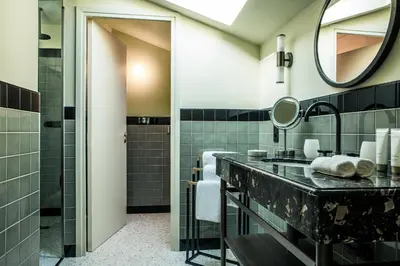 a bathroom with a sink and a mirror at Le Pigonnet - Esprit de France in Aix-en-Provence