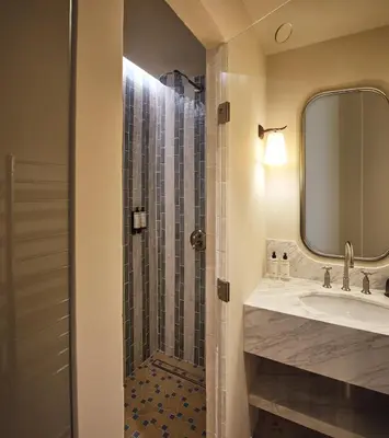 a bathroom with a shower and a sink at Le Pigonnet - Esprit de France in Aix-en-Provence